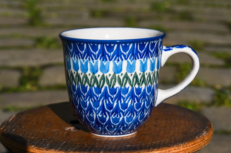 Polish Pottery Blue Tulip Curved Mug by Ceramika Artystyczna Bolesławiec.
