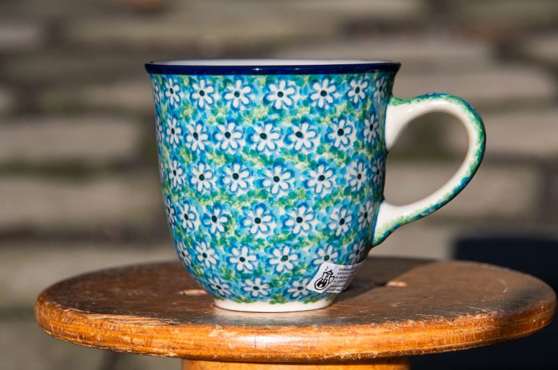 Polish Pottery Curved Mug Turquoise Daisy pattern by Ceramika Artystyczna.
